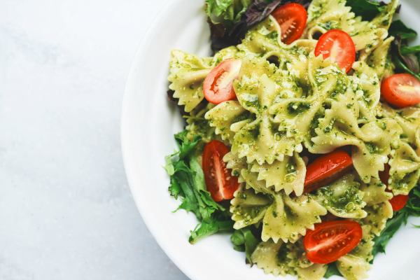 Bowtie Pesto Pasta with Cherry Tomatoes and Lettuce in a Pesto Sauce